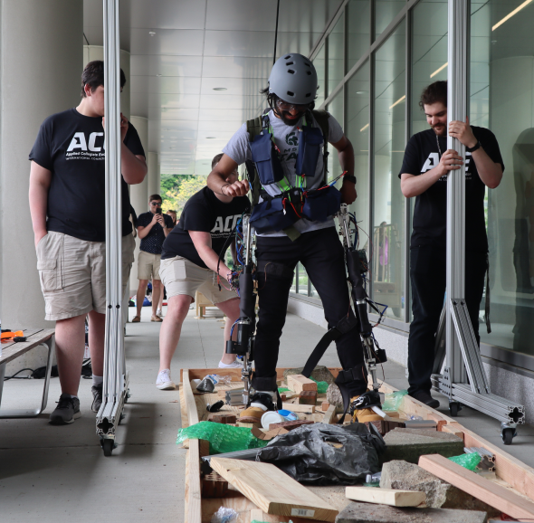 A STARX member piloting the suit through the uneven tarrain obstacle